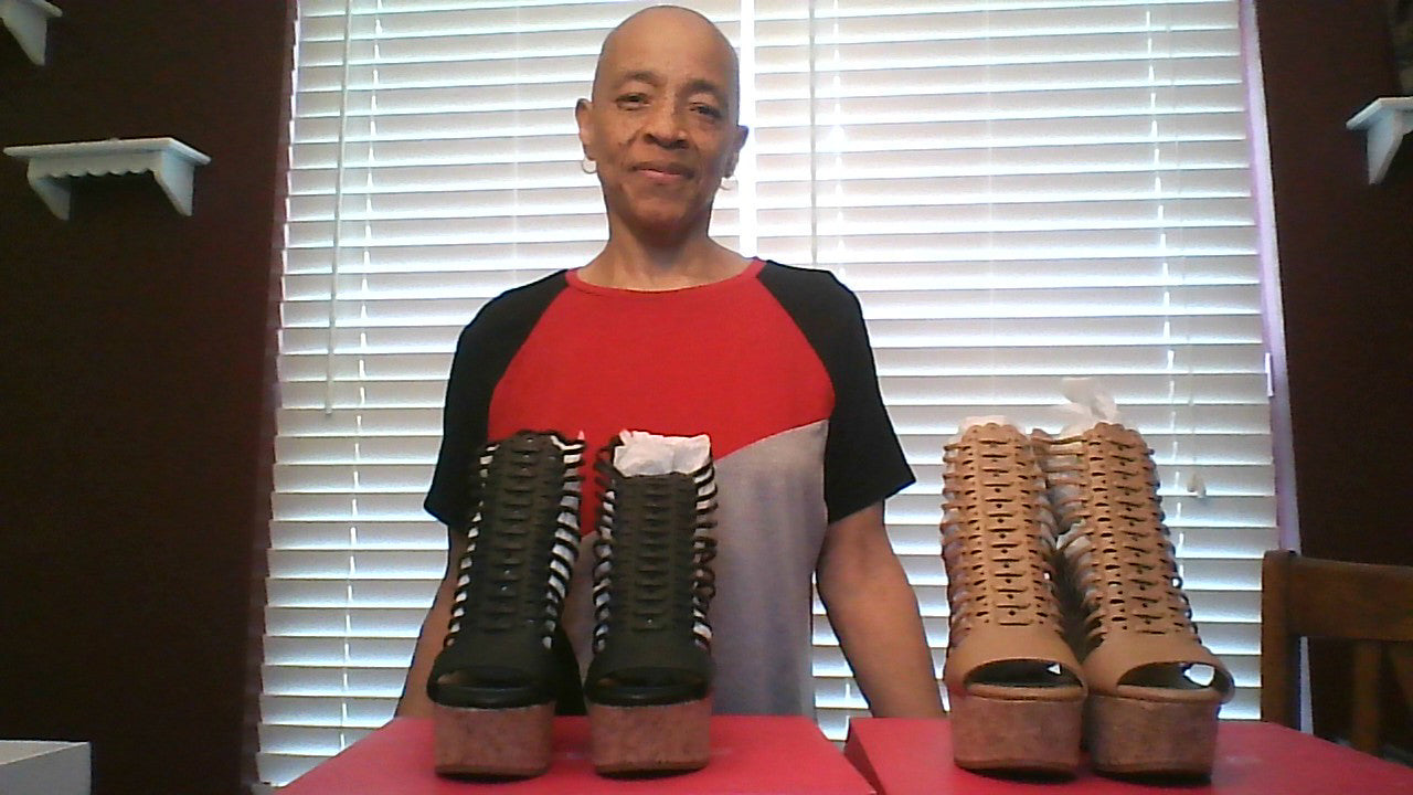 Two pair of wedges Shown together Black and Tan in color