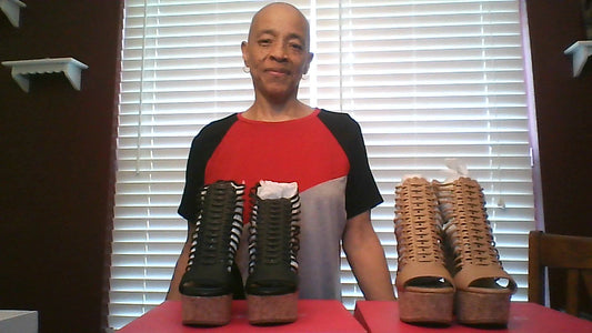 Two pair of wedges Shown together Black and Tan in color
