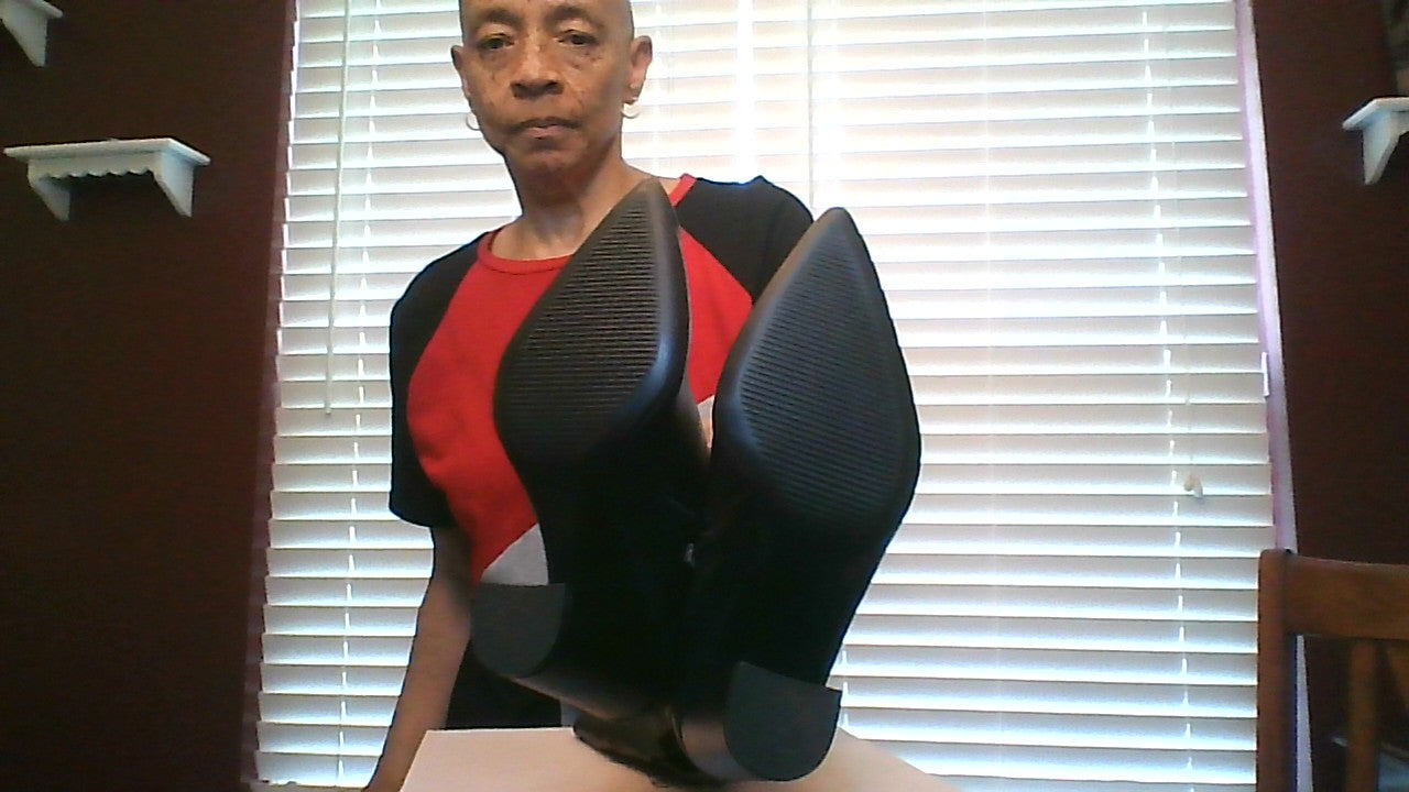 Showing the bottom of women’s size 6 knee‑high boots in black, never worn
