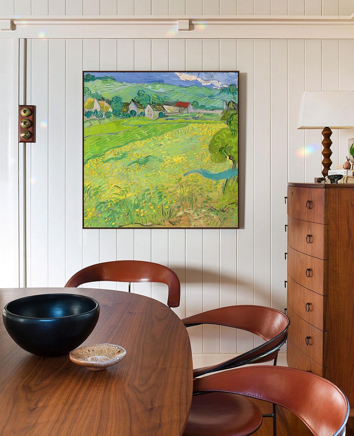 Framed canvas artwork in walnut floating frame shown in dining room wall decor