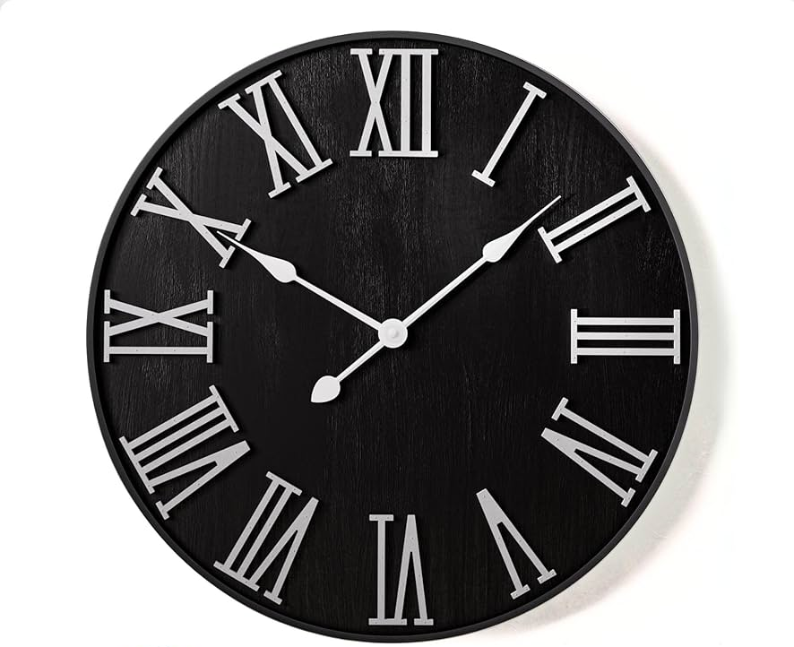 Classic black wall clock with bold white Roman numbers, product image on plain white backdrop"