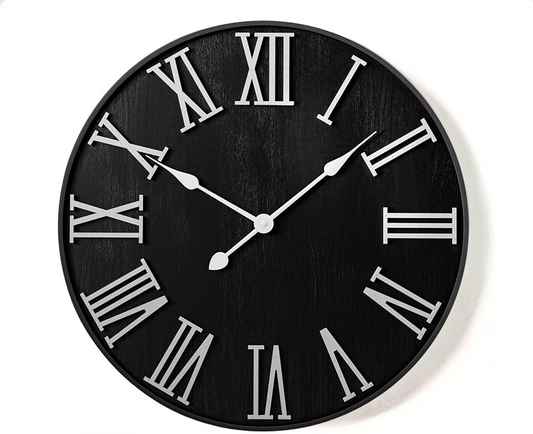 Classic black wall clock with bold white Roman numbers, product image on plain white backdrop"