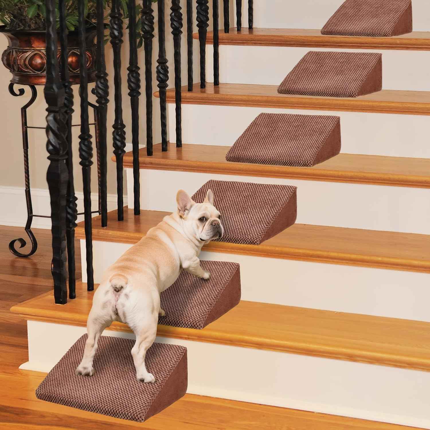 Brown foam pet stairs on hardwood steps with a dog climbing