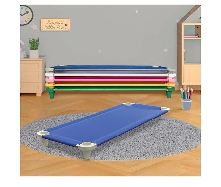 Stack of colorful nap cots on a wooden floor with a gray rug