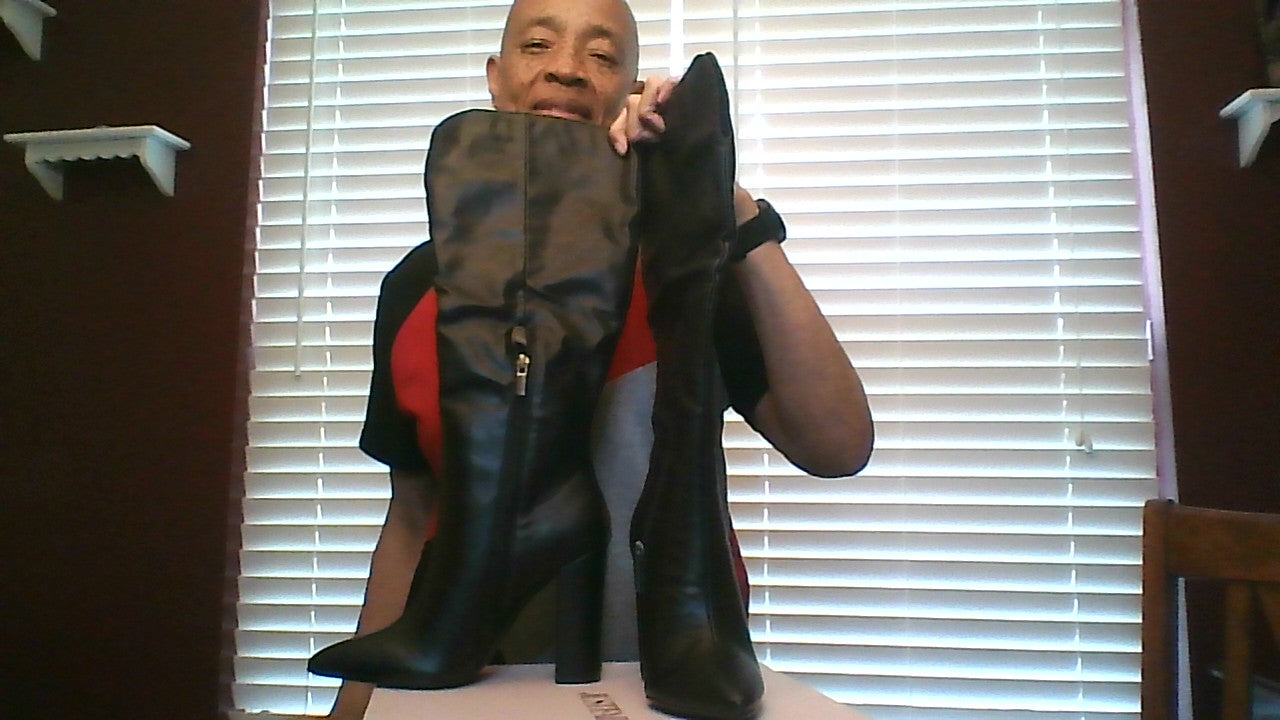 Showing the zippers of women’s size 6 knee‑high boots in black, mid‑heel, pointed toe, side zipper, faux‑leather finish