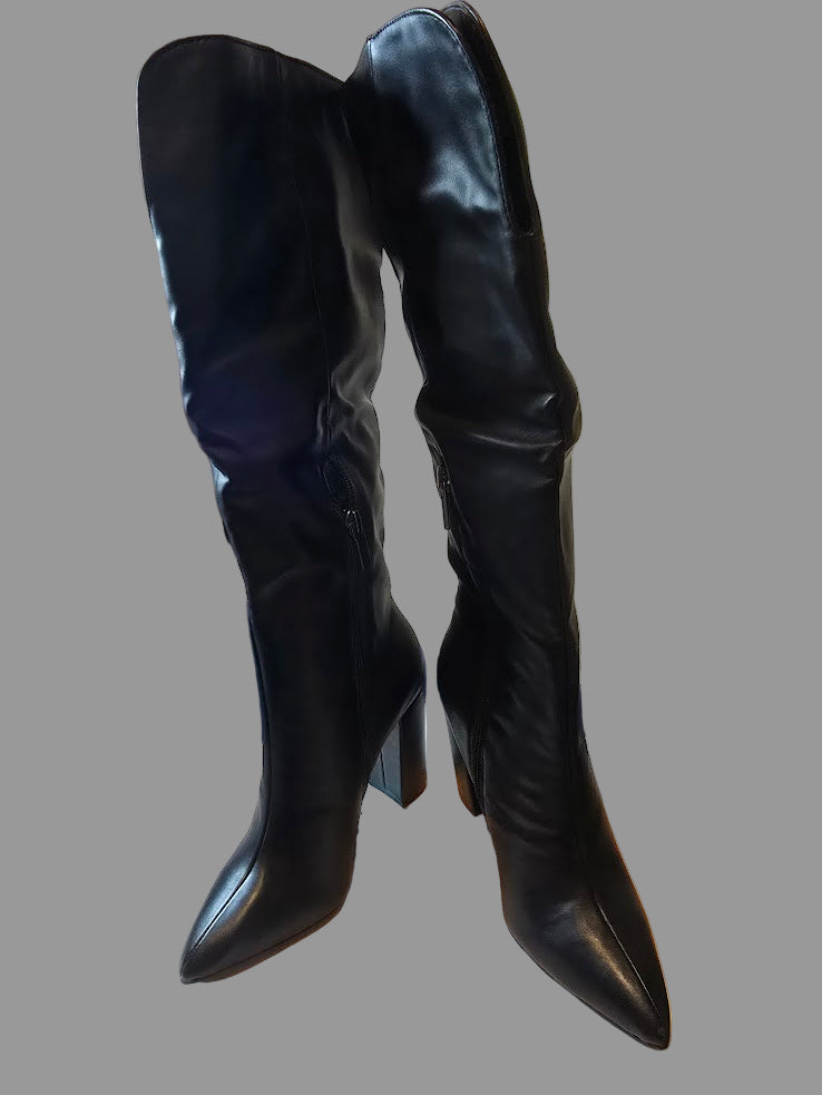 Black knee-high boots with a white background