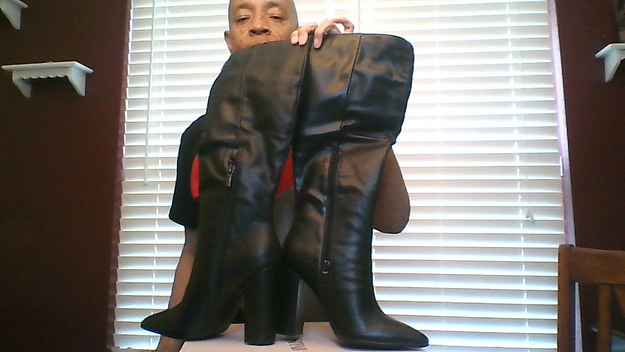 Showing zippers and heel length for black knee-high boots