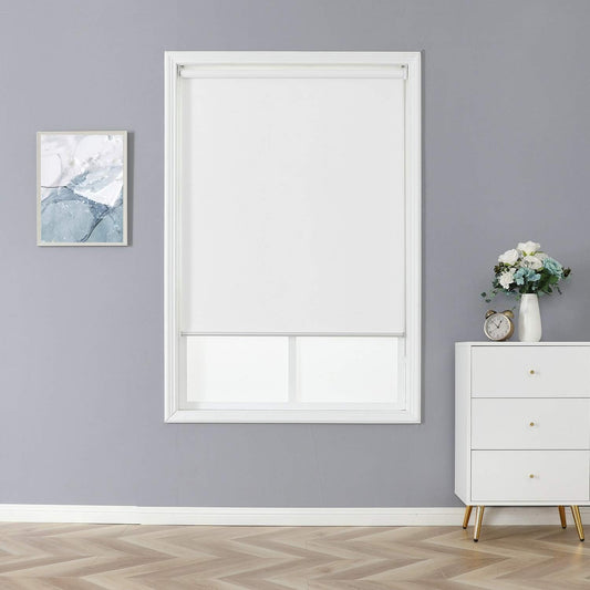White roller blackout shade installed inside window frame in modern room