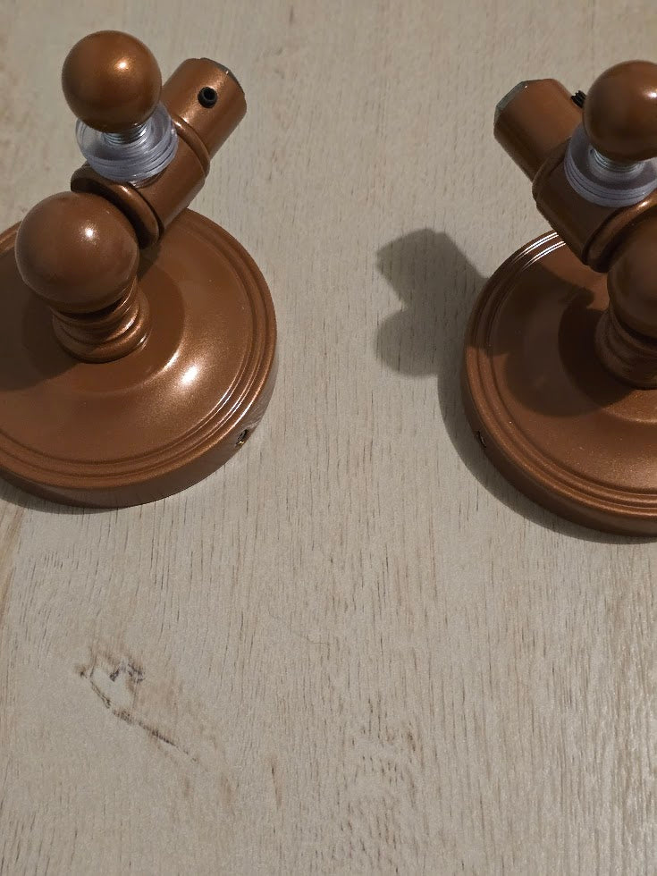 Close up of rectangle tilt beveled edge mirror in, brushed bronze showing hardware details