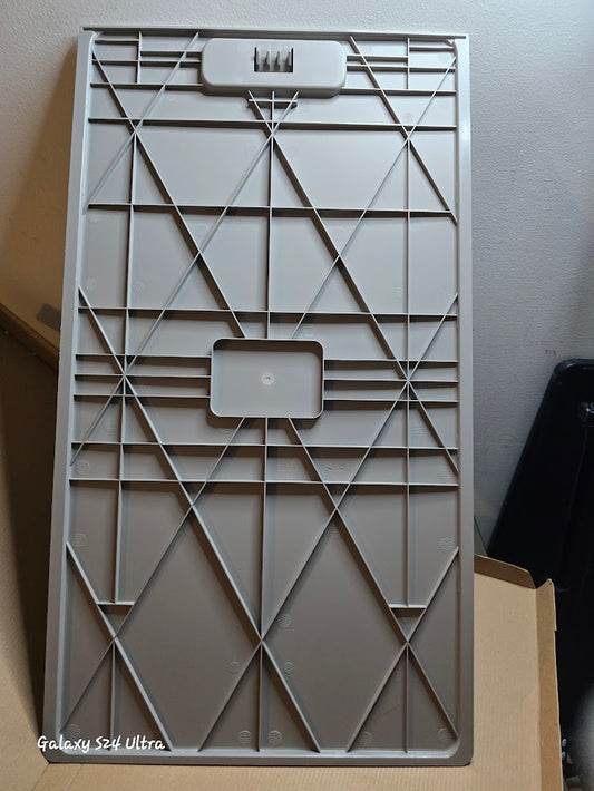 Geometric patterned gray plastic cover on a plain background