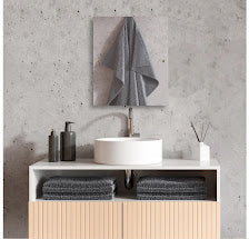  rectangle mirror staged displaying bathroom sink with accessories and gray wall tile